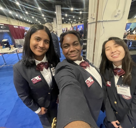 Tolu-Oluwafemi-at-HOSA Tolu Oluwafemi (middle) pictured at the HOSA National Leadership conference in 2025.