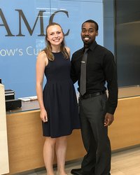 Two interns standing next to each other for picture