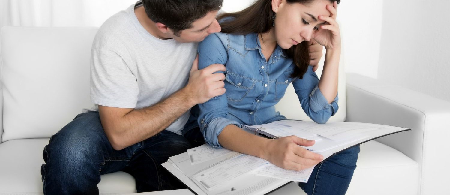 young couple stress about financial problems