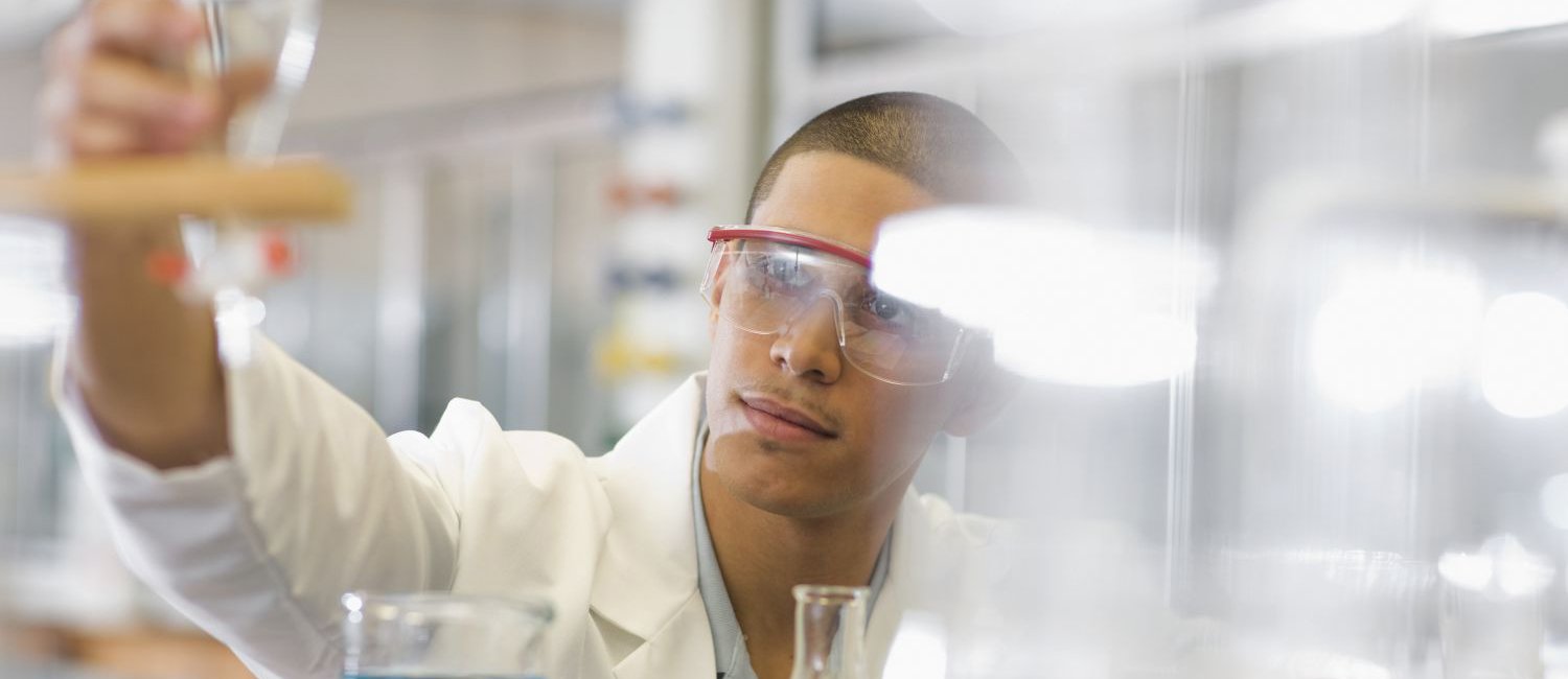 male student working in chemistry lab