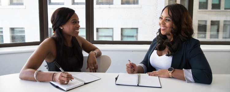 Two Women at a desk interview