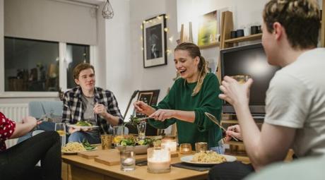 Three people socializing at a table
