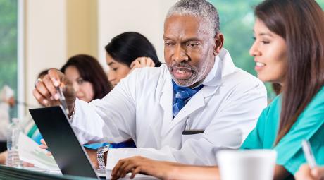 Doctor working with a medical student.