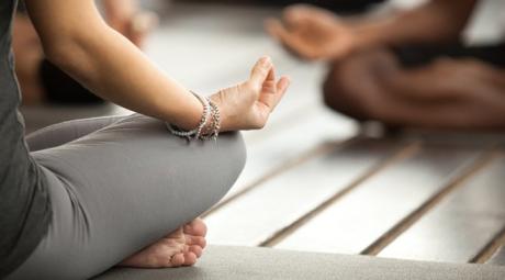 Three people meditating