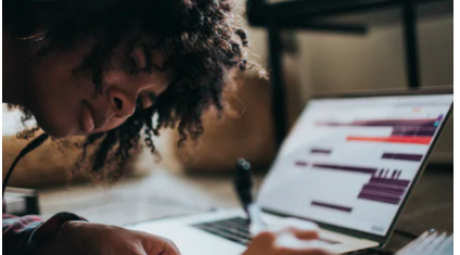 Image of student with laptop.