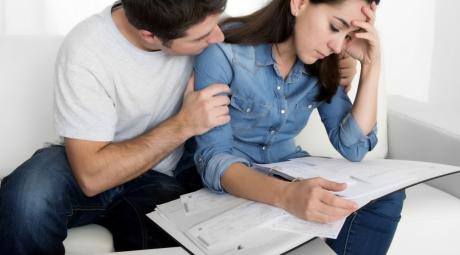 young couple stress about financial problems