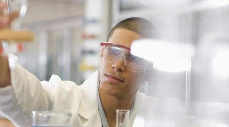 male student working in chemistry lab