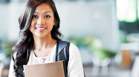 A portrait of a young college woman on campus