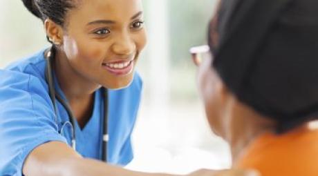 Female doctor helping a patient.