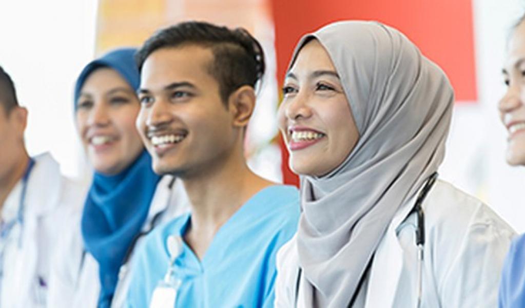 Three health care providers smiling
