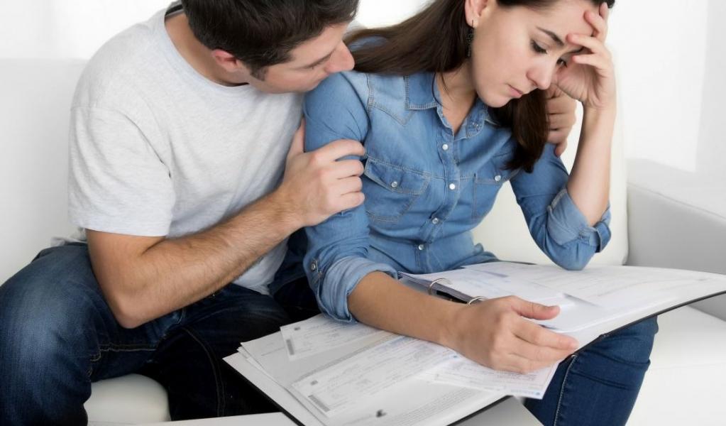 young couple stress about financial problems