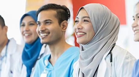 Three health care providers smiling