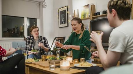 Three people socializing at a table