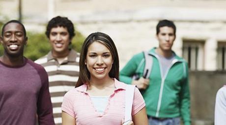 Group of students standing outside college building
