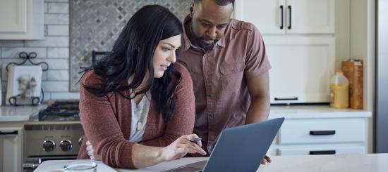Couple Using Laptop